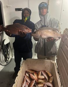 a man holding a fish